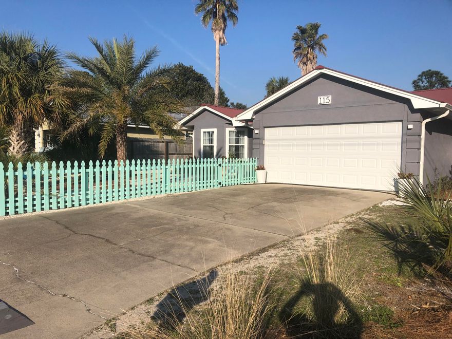Beach House with Pool in Panama City Beach. An updated beach house in a private neighborhood just 3 blocks from the beach with no HOA. This 3 Br 2 BA home features a living room with vaulted ceilings and a fireplace. The Florida style sunroom over looks a beautifully landscaped yard with an inground pool.The kitchen is well appointed with solid surface countertops, white cabinets and a subway tile backsplash and is open to the dining area as well as the sunroom. The master suite features vaulted ceiling and a stunning updated master bath. The landscaping includes Palm Trees and a picket fence surrounding the property. A two car garage with automatic garage door opener completes this home. The HVAC system is approx 1 yr old.The pool filter & pump are 1 yr old. No short term rentals allowed