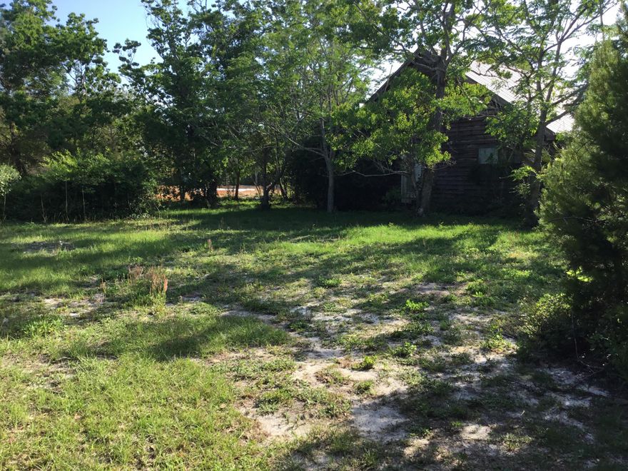 Incredible location on a corner lot just a few blocks from the beaches of 30A. Investor double lot to build on. Home could be renovated with some imagination or taken down and some of the cedar wood could be recycled to use on a new home. New construction is going on directly adjacent to the parcel. Buyer to verify all data and dimensions.