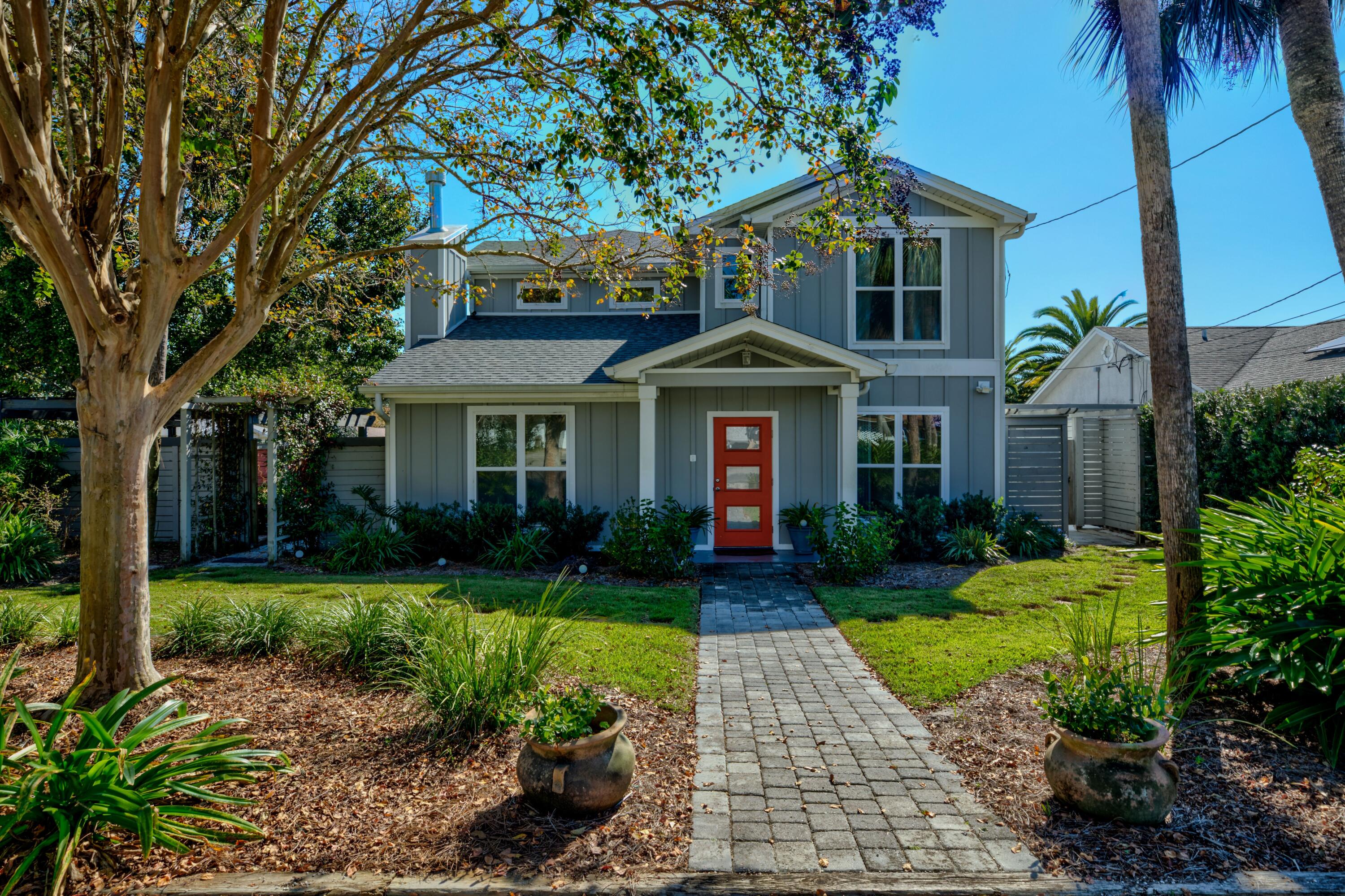 This stunning contemporary home offers an open-concept design, creating a seamless flow between the living, dining, kitchen, and breakfast areas--perfect for both casual family time and entertaining guests. The kitchen boasts all stainless-steel appliances, a double oven, gas range, a spacious island, and sleek quartz countertops accented by mosaic tiles that evoke the beauty of Florida's sandy beaches. The media room overlooks the sparkling pool, inviting you to enjoy poolside fun like volleyball or simply relax on a lazy day. A convenient bathroom located just off the patio provides easy access for pool guests. On the other side of the home, you'll find a serene patio with a koi pond, pergola, and lush landscaping, offering a peaceful spot for morning coffee or dining al fresco. Upstairs