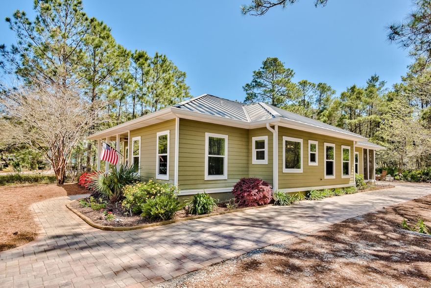 Rare Opportunity! Looking for a hidden gem on the West End of 30A? Look no further!  This beautifully maintained home is conveniently located on a quiet dead-end street and is just a short golf cart ride or short walk away to 3 public beach access points. So close that, on a day when there is a South wind, you can hear the sounds of waves crashing on shore as you relax on your oversized screen-in back porch. The outdoor living space is a perfect place to enjoy the sweet songs of birds while sipping your morning coffee! Move in ready, this recently remodeled, meticulously kept home has beautiful tile floor throughout. The stunning kitchen and dining area is perfect for the aspiring chef and features upgraded granite/quartz countertops stainless steel appliances and a stunning backsplash.