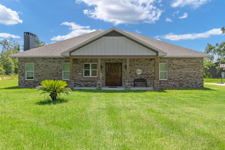 Experience the perfect balance of privacy and convenience with this custom-built brick home, set on nearly 10 acres in northern Bay County. Built in 2020, this spacious 3,385 sq. ft. residence features four bedrooms and three-and-a-half baths, with a thoughtfully designed layout ideal for comfortable living and entertaining. Inside, you'll find engineered French oak flooring, granite countertops in the kitchen and baths, a custom built bar, commercial style gas stove, beverage/wine cooler, an open concept living area, and timeless finishes throughout. A detached garage offers additional storage or workspace, making this property as functional as it is beautiful. The home is also equipped with a whole house Generac generator. A second propane tank is for the kitchen stove and tankless heater in the master bath. Enjoy the peaceful setting without sacrificing accessibility  this home is a short commute to Tyndall Air Force Base, convenient to Panama City for shopping and dining, and just a quick drive to the white sandy beaches along the Gulf of Mexico. This property offers plenty of space for outdoor activities, gardens, or future expansion, making it a rare opportunity to own acreage with easy access to the best of Bay County. If measurements deemed important, please verify.