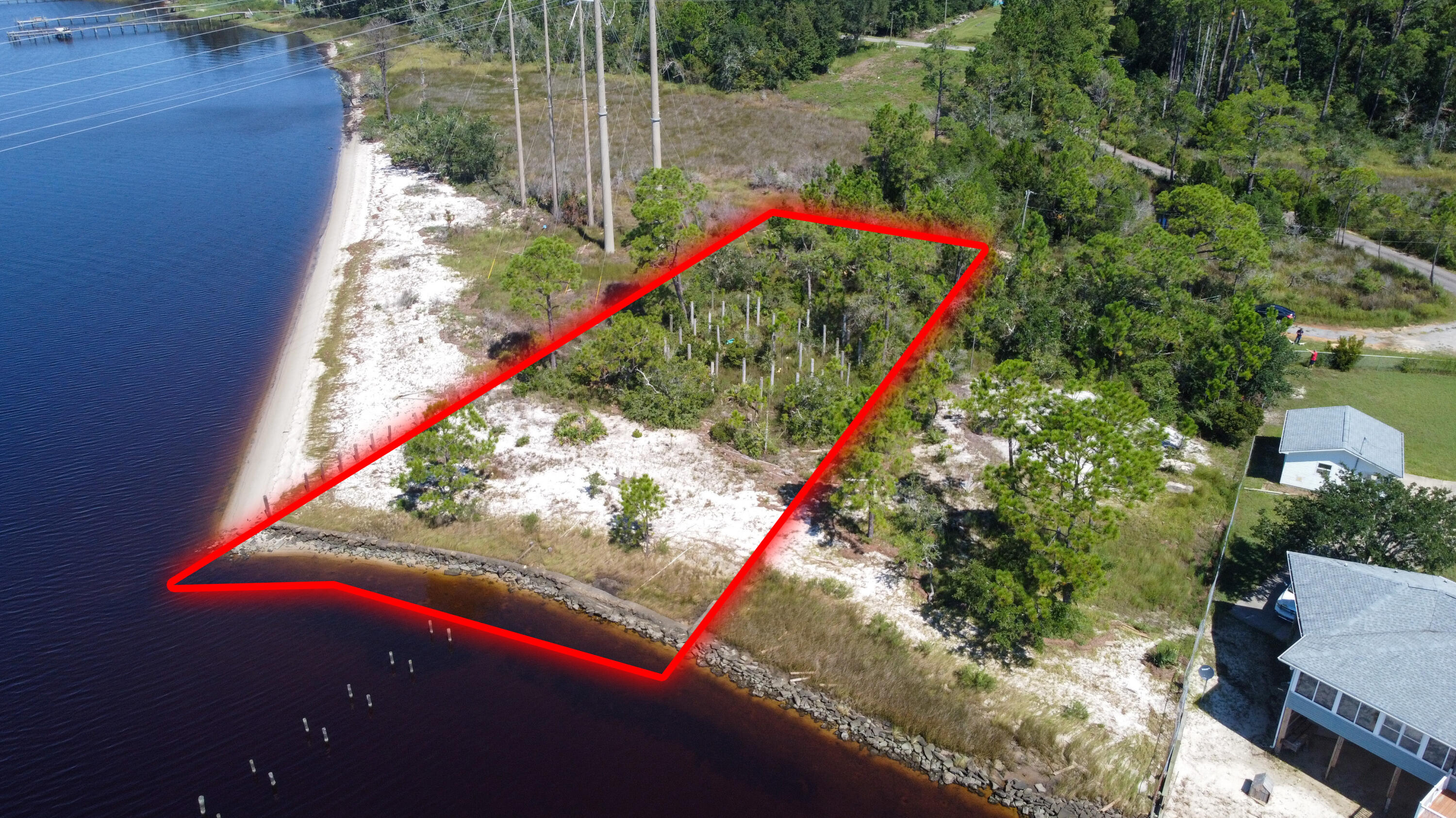Build your dream home on this beautiful East Bay front lot. Gorgeous views with lots of privacy. Must see to appreciate. There are pilings in place for a dock. Usability unknown.