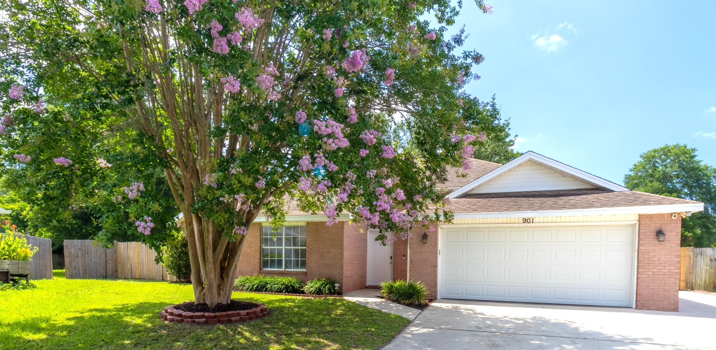 Welcome to your dream home in the highly sought-after Mills Landing neighborhood of Fort Walton Beach! This stunning 4 bedroom, 2 bathroom residence offers 1,789 square feet of comfortable living space with a range of modern updates and renovations. Enjoy cooking in a beautifully renovated kitchen featuring granite countertops and stainless steel appliances; cozy up by the wood-burning fireplace and take in the clean and inviting atmosphere throughout this freshly painted home. Each bedroom is generously sized with large closets, offering ample storage space. Upon entering the backyard, be prepared to be stunned by the size of your own personal oasis! This backyard would be perfect for entertaining or to create your own backyard retreat with privacy fencing and a well irrigation pump! Rest easy knowing that a brand new 40-gallon electric water heater with Tank Guard and Smart Technology has been installed and that the HVAC system was installed in 2017, ensuring efficient climate control throughout the year. A new roof is scheduled to be installed upon execution of an accepted offer (roofing company has been identified by seller with quotes in hand). The spacious two-car garage features built-in cabinetry and a hurricane-rated garage door. Additional storage is available in the outdoor shed that conveys with the purchase of the home along with the washer and dryer. Three camera Ring security system easily transferable to buyer! Enjoy easy access to both Eglin Air Force Base and Hurlburt Field, along with local schools, parks, shopping, and dining options. Fort Walton Beach offers easy access to beautiful beaches and outdoor activities. Don't miss the opportunity to own this beautifully updated home in Mills Landing; schedule a showing today and experience the best of Fort Walton Beach living! *Please request to review survey for lot line clarification/confirmation*