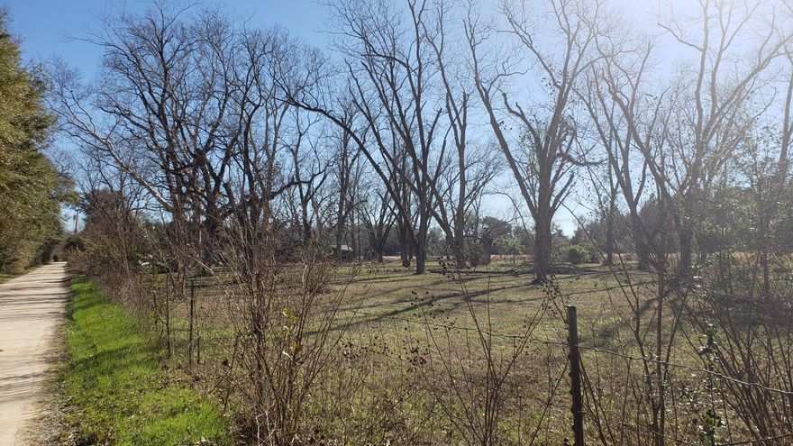 11.5 Beautiful Acres on the Florida/Alabama State Line ~ Utilities in place for a main home also located in the northeast corner, an additional pad with utilities ~ 3 Pole Barns with plenty of storage for outdoor equipment ~ Chicken pen ~ Fenced ~ City Water ~ City Gas ~ Septic Tanks ~ Acreage is full of Pecan Trees along with a few Pear ~ Pomegranate ~ Fig ~ If you want room to roam or need a place for your horses, this is a Great Option ! Check it out.