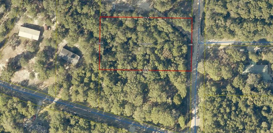 Great location on this lightly wooded, 1 acre lot on paved road.! Located in the Juniper Lake area of Defuniak Springs. This lot is only  minutes from downtown Defuniak Springs & I-10.  Electric is available on the street; public water is available (will need to pay tap fee) and septic tank would be required. Great place to build your dream home or have manufactured home put on lot.