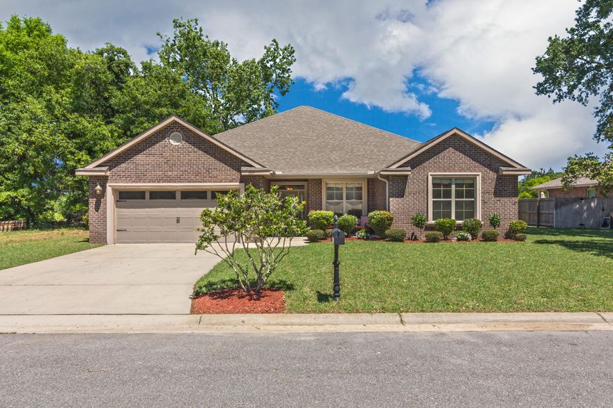 Turn key home, ready for new owners! This home is a beauty, w/great upgrades throughout: 10 foot ceilings, updated wood laminate flooring in living spaces, ceramic tile in kitchen/baths, recessed lighting, trayed ceilings, crown moulding-the works! The master bedroom has it's own double door entryway and is secluded to the left of the massive living room. Bath area features marble countertops, dual vanities, garden soaking tub, standalone shower, and a large walk in closet. The 3 additional bedrooms are down a hallway off of the kitchen area and share 2 guest bathrooms. Marble countertops are also found in the guest baths. Kitchen is a showstopper with countertop bar seating, granite countertops, custom cabinetry, and double undermount sink. Backyard is fenced and highlighted by paver pat