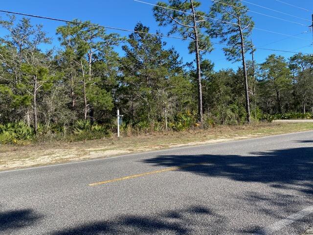 If you have been looking for that perfect lot to build your new home, here it is! Appears to be zone X, high and dry, but buyer needs to do their own due diligence to ascertain that the property is suitable for what they have planned. Backs up to the State Forest. No HOA or build out time. Close to WalMart, Publix, and Sacred Heart. Plenty of room for your boat or RV. Adjoining property on Bambi Place also for sale. Buy both lots and have well over a half acre. No Tap fees paid, but Water, Electricity, and Sewer are available.