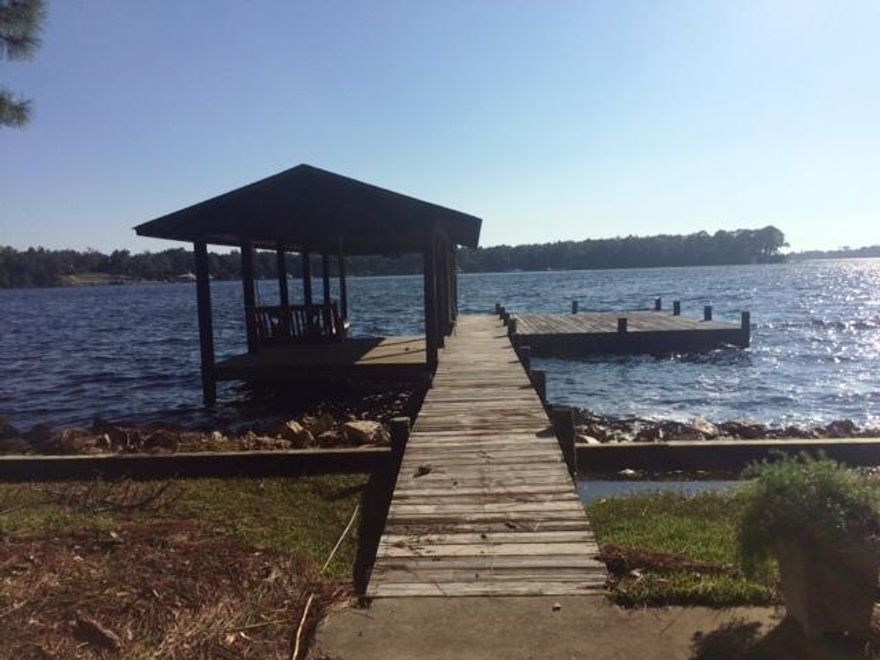 Large lot in highly desired Edgewater Village with 106 feet of deep water access. Boat house in place and was built in 1980. No photos of home available as value is in the lot which happens to have a structure on it. Property is being sold as-is, buyer to verify any information they deem important.