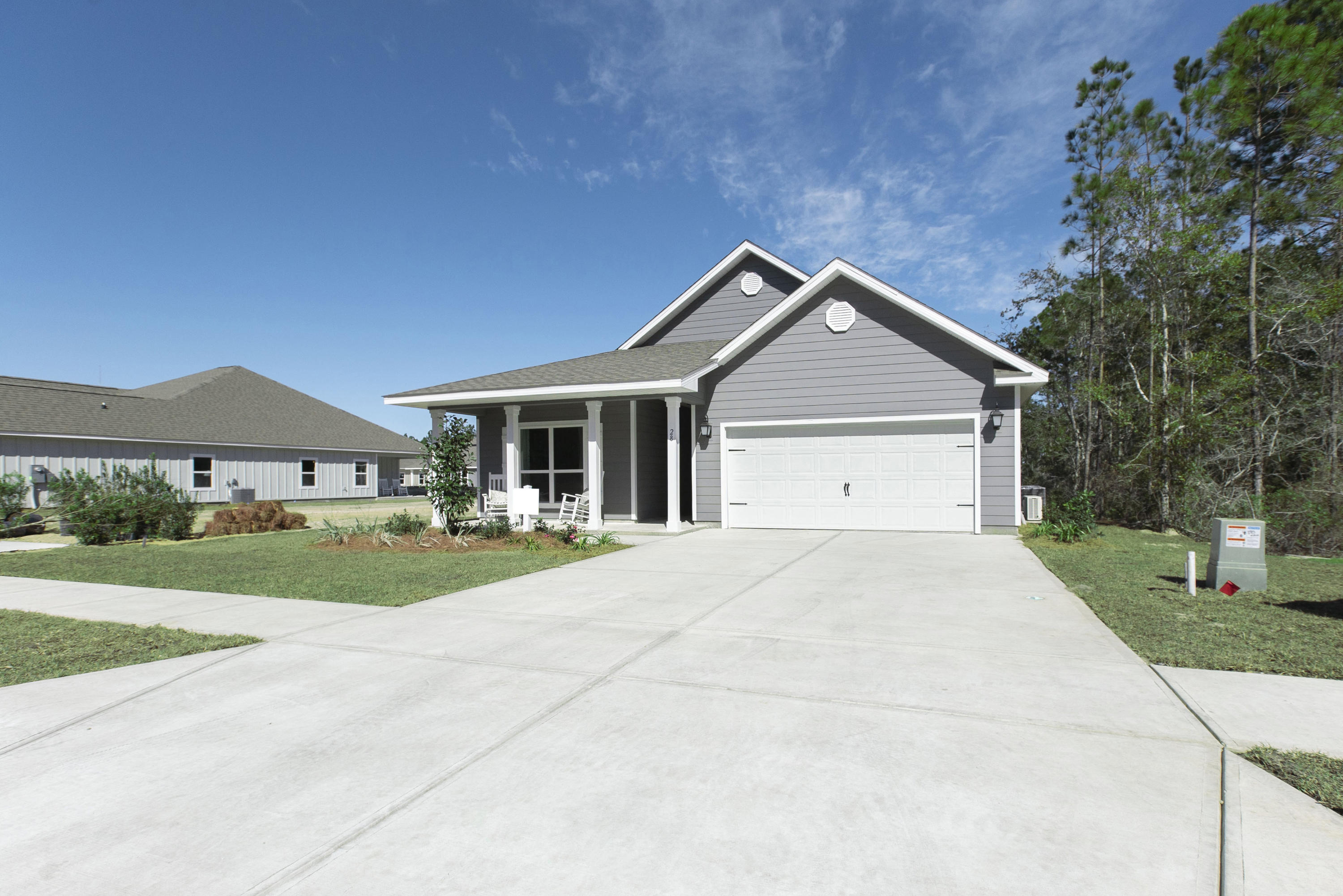 Welcome to Stonegate! South Walton's brand new construction community built by the leading builder in the Nation for over 15 years! Beautiful 4 bedroom ranch home that has the WOW factor the moment you walk into the front door. Light EVP flooring, hand painted cabinets, granite countertops, LED lighting, new SMART HOME PACKAGE and more are a few standard features of this new home. Gorgeous kitchen open to the family room separated by a large kitchen island with storage. Extremely spacious Master bedroom with en-suite bathroom. His and her closets, large double vanity and 5 ft. Tiled shower with bench seat are just a few highlights. Sit out on your large covered back porch with a view of the state forest while enjoying your coffee in the mornings.