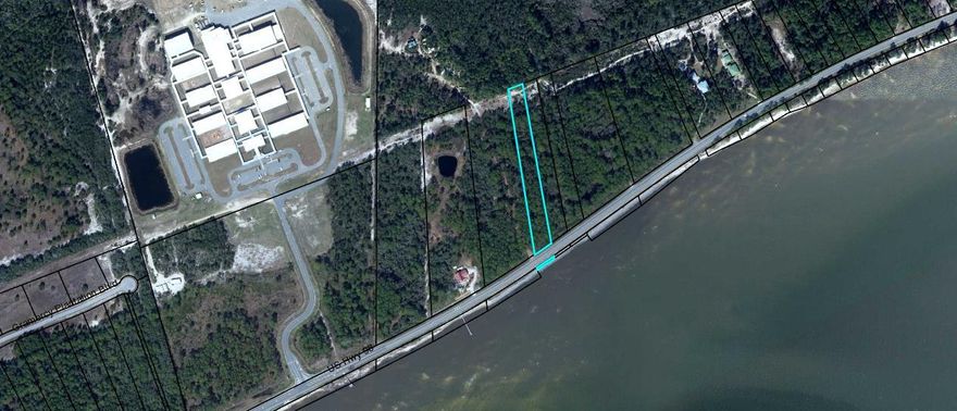 1.94 Acre wooded lot with magnificent frontage on St. George Sound. Buyer can build boat dock for access to bay. Seller has had front 1 Acre cleared to help visualize home location/view. Owner financing available.