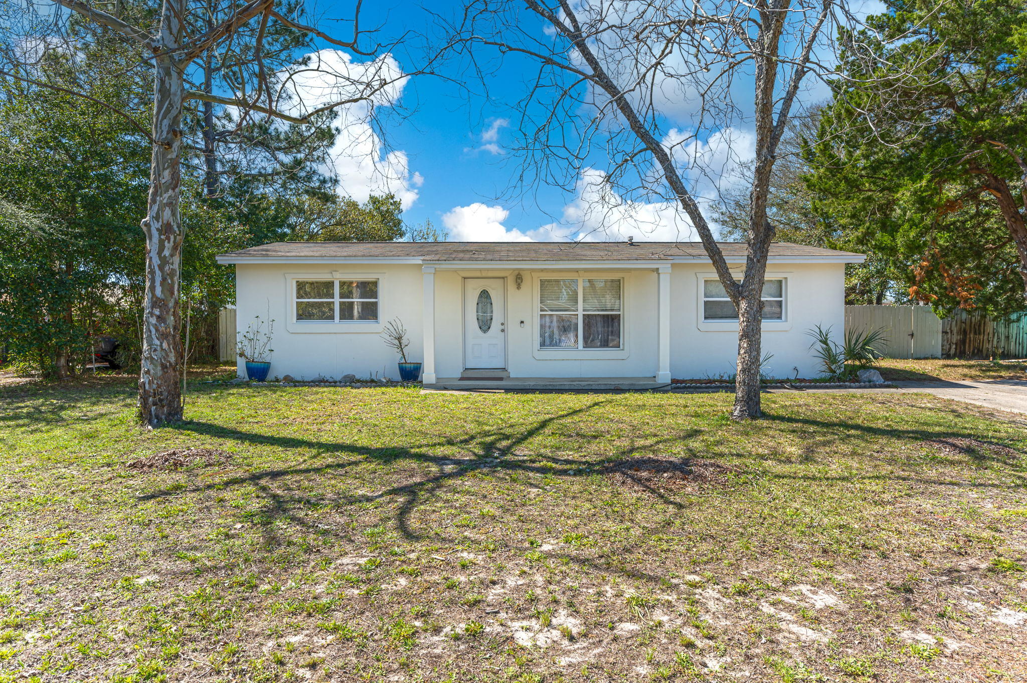 Listed below a recent appraisal and new roof just completed! You will fall for this adorable 4 bedroom, 2 bathroom home with a deceiving amount of space, and a welcoming, open floor plan. Porcelain tile throughout the home makes it very low maintenance. The kitchen is updated with granite countertops, and newer cabinetry and appliances. The master bedroom has plenty of room and features an en-suite bathroom with a beautiful tiled walk-in shower. The home features many upgrades, including windows and a newer HVAC unit. Come see this one today, you won't be disappointed!