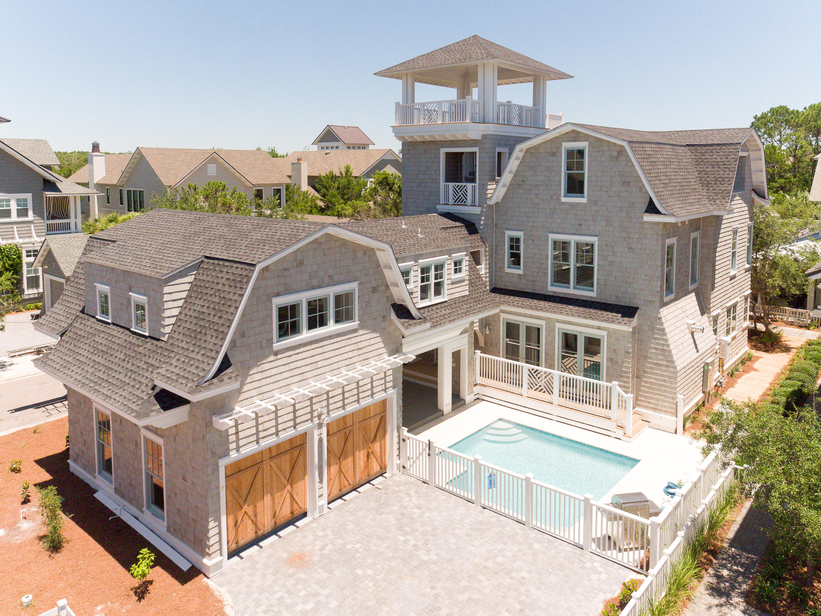 Construction complete! This coastal inspiration captures the essence of WaterSound Beach perfectly with its inviting floor plan and extraordinary use of outdoor living spaces that complement the dramatic interiors. Immediately, you will be drawn to the stunning inner courtyard which boasts a private pool and large covered porch, designed to maximize the indoor/outdoor connection of the home. Inside, the interior spaces are well-proportioned and include first class finishes throughout such as rough hewn oak floors, custom wood mouldings, Circa lighting, Wolfe and Sub Zero appliances, Tile by Walker Zanger, beautiful marble and granite counter tops, custom cabinetry through out and so much more. In addition to the two car garage is a luxurious carriage house with all the upgrades!