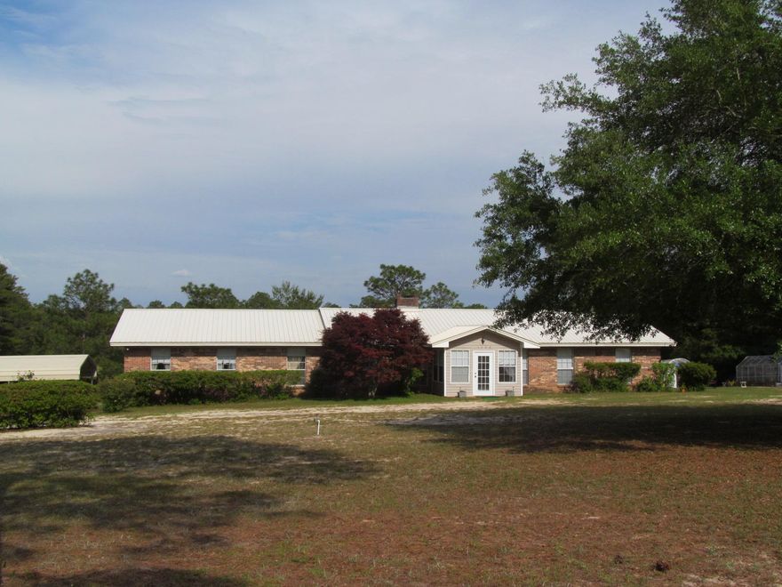 Big & Beautiful. This classic 4 bedroom, 3 bath brick home comes with its own detached one bedroom furnished guest quarters. The 5.26 acres gives you plenty of room to roam. No neighbors on top of you !The property is less than a quarter mile from The Juniper Lake Public Boat Ramp. The house was totally restored in 2010 including the addition of a master suite, a new 7 ton CH&A, a new kitchen with maple custom cabinets and granite counter tops, custom lighting through out, new tile floors, upgraded plumbing, all new soffits and and a new metal roof on the main house & the guest house. If you love gardening you will love the two greenhouses included in the sale! A portion of the property fronts on Juniper Creek. Due to pets and elderly mother 24 hours notice is required.