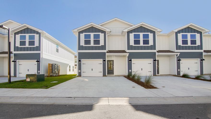 This stunning townhome is located at 22 Phoenix Street in Hawk's Landing. This townhome features the Palm exterior floor plan and is a perfect blend of style and comfort. Step inside to find a welcoming space that boasts 3 well-appointed bedrooms, 2.5 elegant bathrooms, and a convenient 1-car garage. As you traverse the long hallway, you're greeted by an expansive open-concept kitchen, living, and dining area, designed for entertaining and everyday living. The kitchen serves as the culinary center with its spacious center island, granite countertops, and a premium Whirlpool(r) stainless appliance package. The living area is well illuminated with exterior windows and a glass door leading to the back patio. The first floor is the core of the home, while the privacy of the second level holds all bedrooms, ensuring a quiet retreat. The main suite is a sanctuary, featuring a generous closet, an oversized shower, dual sink vanity, and ample linen storage in the en suite bathroom. Additional bedrooms share a full bathroom, creating a comfortable space for family or guests. EVP flooring flows throughout the townhome, uniting each room with durability and elegance. Smart Home Technology Package comes standard, featuring a Qolsys IQ touch panel for thermostat and lighting control, ensuring security and convenience with a keyless KwikSet deadbolt. A landscaped front entry adds curb appeal and welcomes you home to your very own slice of Florida paradise. Welcome to Hawk's Landing, where your dream home awaits. 