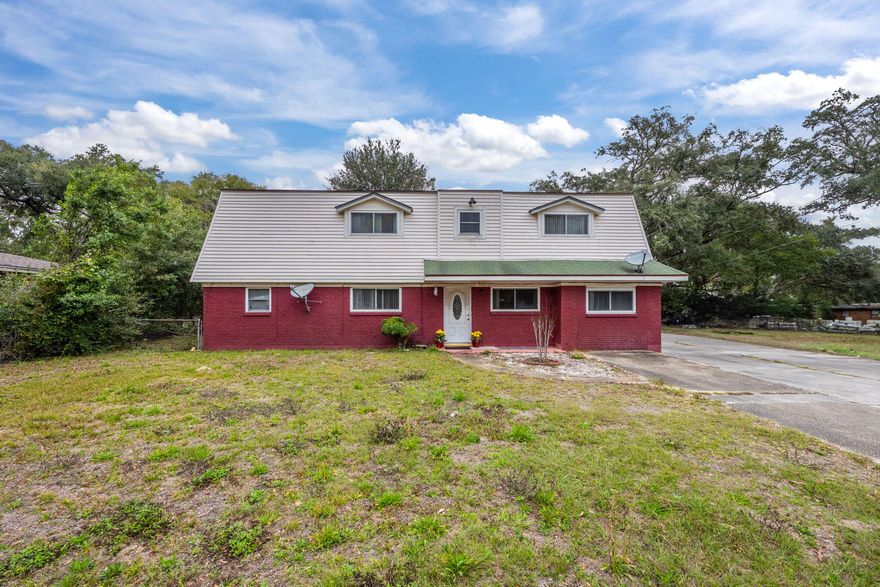 CAN BE REZONED FOR COMMERCIAL USE. 2,600 SQFT, 2 Story. Being sold AS IS. This spacious 6-bedroom, 3.5-bath. Located on a high-traffic main road, it's ideally situated next to malls, the airport, and the interstate, making it perfect for rezoning to commercial use. Whether you're looking for a large family home, a rental investment, or an Airbnb, this property offers endless potential. Features include generously sized rooms, a large dining room, and ample living space.