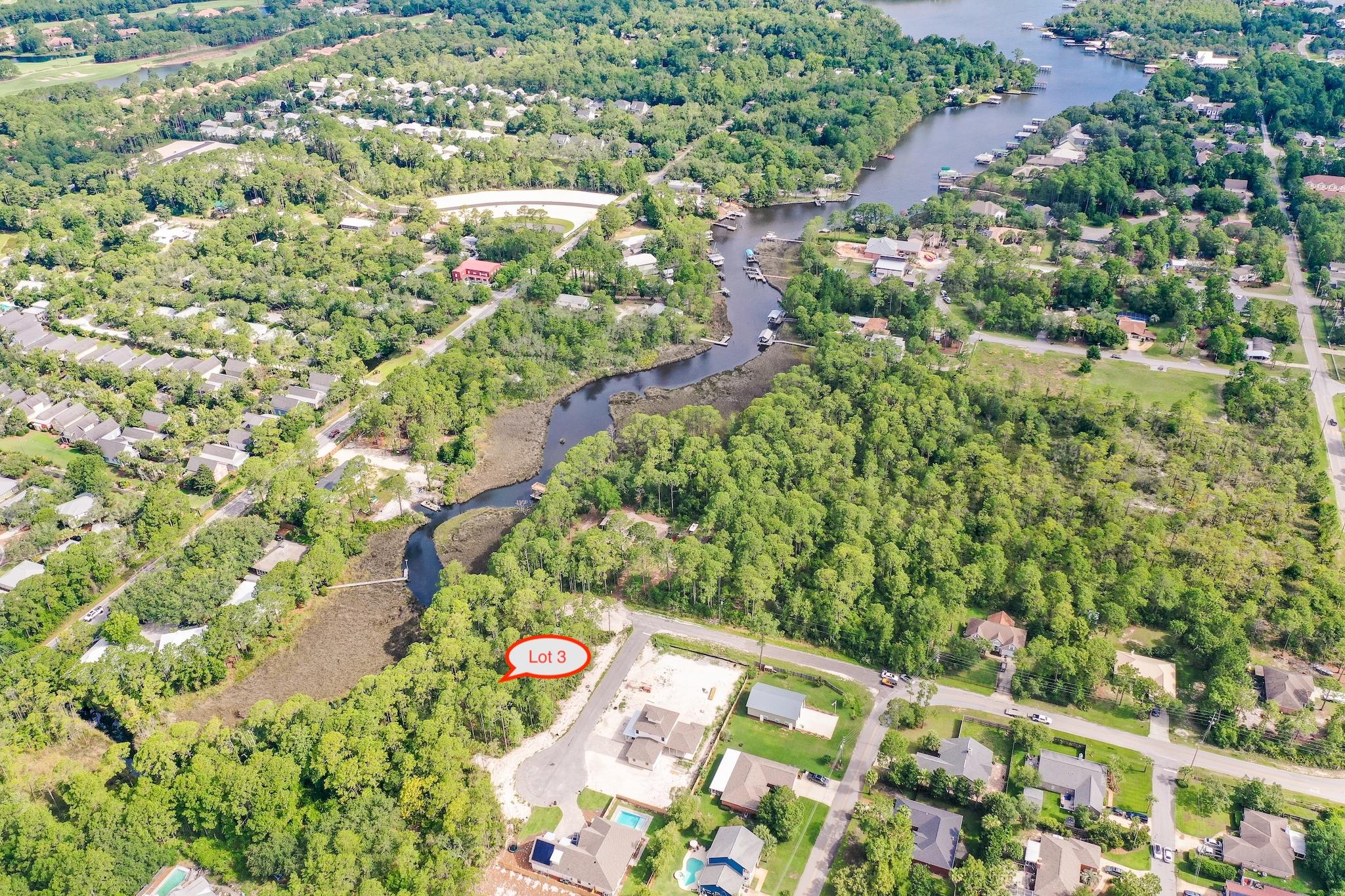 Large canal front lot leading out to the Bay in a brand new community! The developer's current plans are to have a community dock and fishing pier located just two lots down! Conveniently located close to Grand Boulevard Shopping Center, restaurants, Sacred Heart Hospital, and just minutes to 30A as well as Miramar Beach. The beach is just a quick 5-10 minute drive. Tap fees have been paid and utilities are already in place. This lot will make for the perfect canal front new home. Come take a look! Buyer to verify all information contained herein.