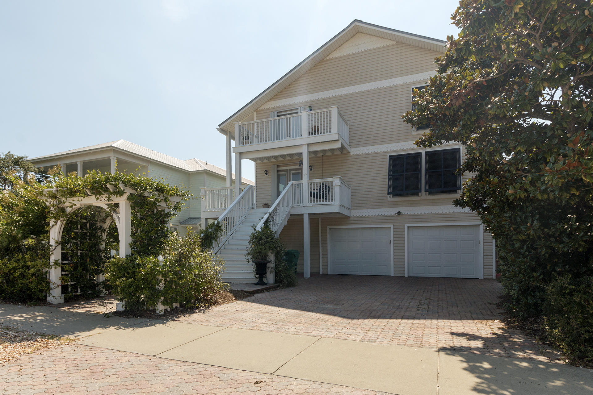 Amazing 3BR/3BA, 2,908SF home with a 2BR/2BA, 963SF lock-out. This home is located in an exceptional location, just a block from the beach. The main home has been upgraded with wood flooring, granite countertops, & stainless steel appliances. The 3rd floor has a large master suite with balcony & a living room with built-in bookcases. The lockout is on the 1st floor and has a private entrance with access to the private pool. Other features include hurricane shutters, a large 50x150 lot, privacy fence, & yard building. This home would make a great rental property, second home, or primary residence. See you at the beach! Furnishing & washer/dryer are negotiable
