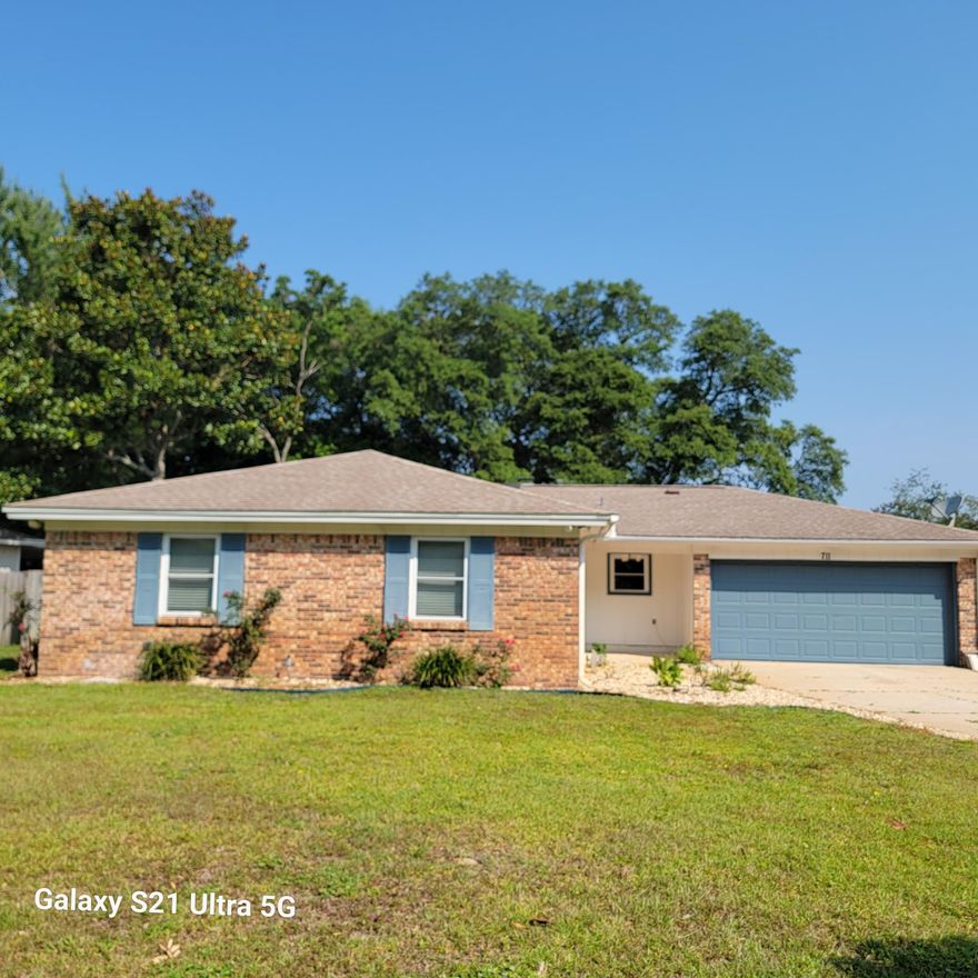 All brick three bedroom two bath home in Bluewater Bay.  Large living area to the left of foyer with kitchen and dining area to the right.  Florida room located off kitchen/dining area. All  bedrooms are spacious with the primary suite located at the back of home.  Large backyard with a large yard building that has power.  Two car garage complete the package. Practical Notes: garage door 2002;  Roof 2015; HVAC 2020; Water heater, electrical panel 2022