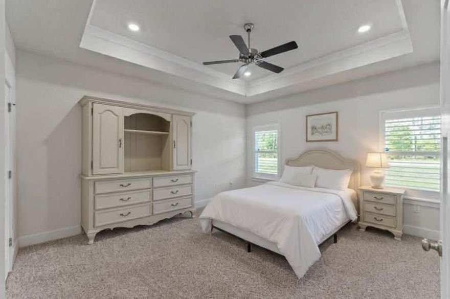 Better Than New! On a cul-de-sac in a pool community. ASSUMABLE VA mortgage at 2.37% This gem is designed for comfort and convenience. Breath easy with state-of-the-art  Reme-Halo Air Purification System for pristine air quality. The home also features seamless gutters, Plantation Shutters,  Smart Home Connect System, with a video doorbell, keyless entry, a full home security system, and Dayco smart switches. Step onto the charming covered front porch, a perfect place to unwind. Inside, the chef's kitchen boasts a large granite island, ample cabinet space, and sleek stainless steel appliances. Opening seamlessly to the spacious living and dining areas for effortless entertaining. The primary en suite offers pure relaxation, featuring a garden tub, stand-up shower, double vanity, walk-in closet. 
Enjoy year-round gatherings on the large covered back porch, perfect for entertaining or quiet mornings. Plus, a 3-car garage provides ample storage space for vehicles, tools, and outdoor gear.