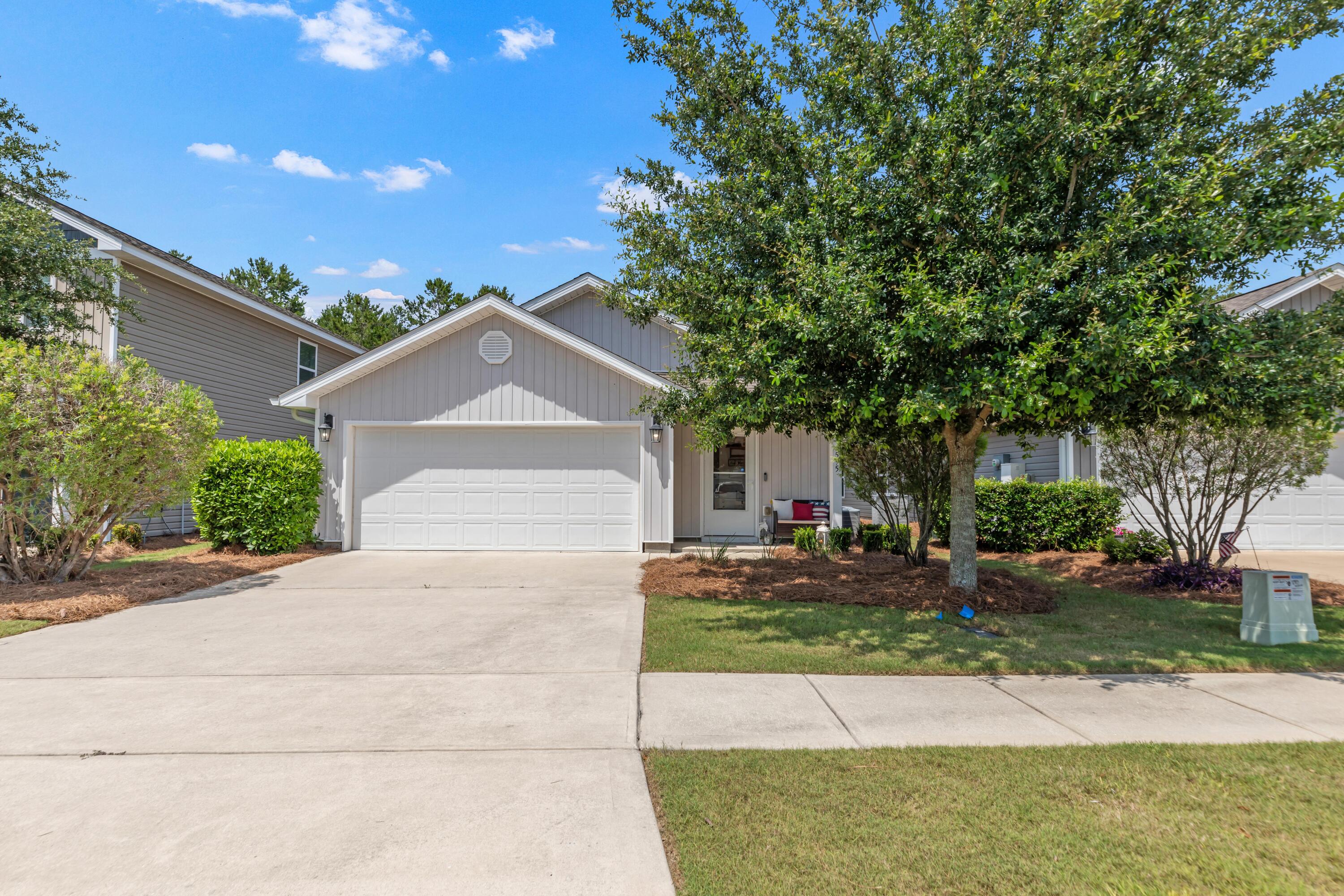 Charming 3/2 single story home with 2 car garage in Crescent Mill at Hammock Bay! This home has it all: beautiful front yard shade tree, covered front porch, front storm door, large foyer with coat closet, crown molding, LVP floors throughout, open floor plan with welcoming kitchen, primary bedroom/bath at rear of home, laundry room with upper cabinets, gutters, huge backyard paver patio, and even lawn care covered by the HOA. HOA fee also includes access to all amenities including the 8,000 SF fitness center, three swimming pools, three clubhouses, walking trails, 60 acre sports park, 500' pier, and all resident activities in The Windmills such as farmers markets and concerts! Sellers offering two months HOA fees, washer/dryer and refrigerator. Buyers to verify all dimensions and info. Buyer to verify all dimensions and information important to them.