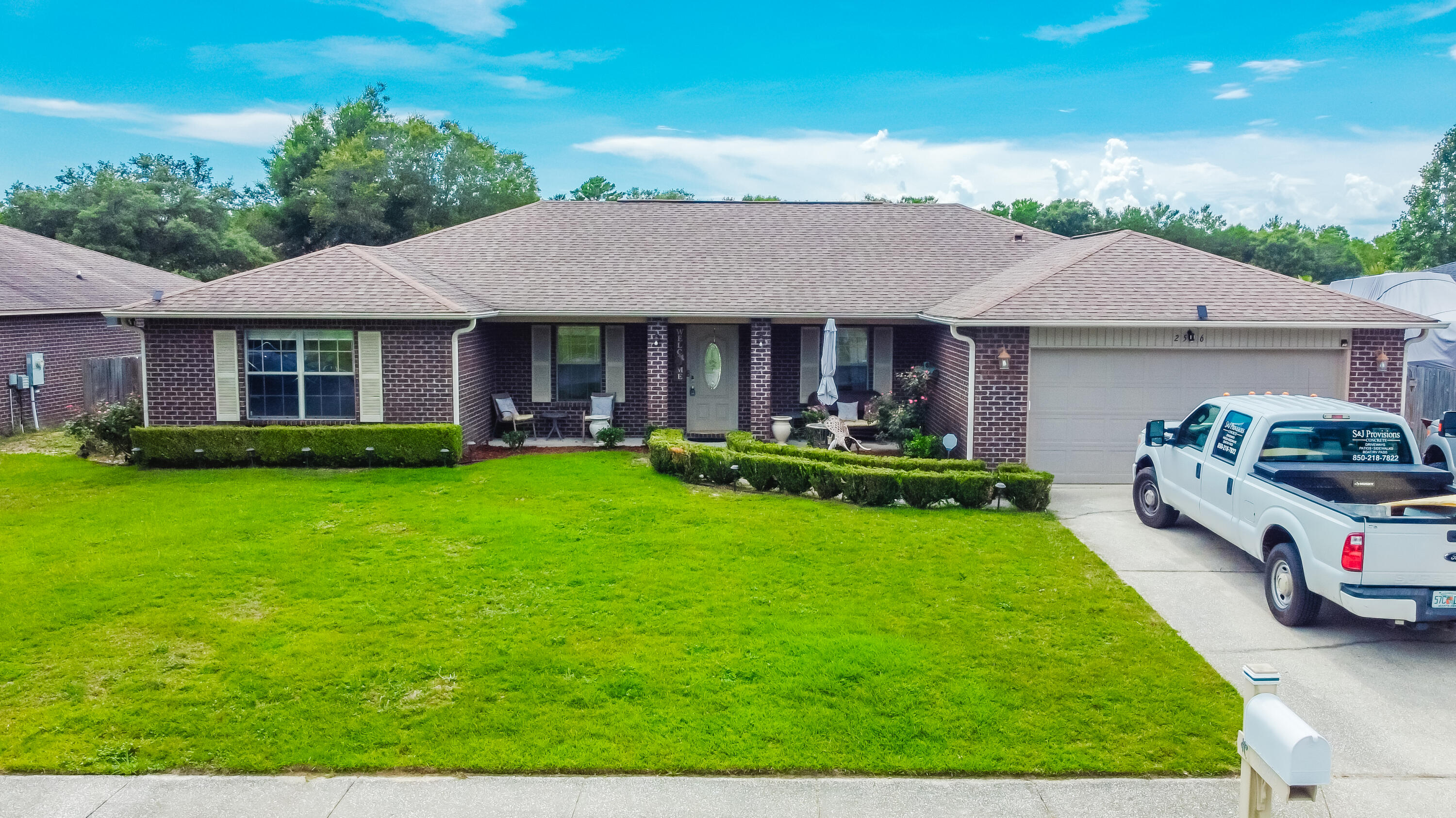 Beautiful home with several amenities in Navarre! Located in Harvell's Crossing off E Bay Blvd, the property showcases a fenced backyard with several fruit trees, fire pit, a custom brick BBQ smoker that has cooked some of the most amazing meat, sprinkler system with lawn pump, & an open patio with remote Sunset awning. The interior features vaulted ceilings, hardwood floors, an office/flex space, and new tile & vanity in the full bathroom. The kitchen includes stainless steel appliances, granite countertops, ceramic tile flooring, upgraded cabinets & kitchen island. Separate from the other bedrooms, the owner's suite has a double vanity, two walk-in closets, & a garden tub in owner's bathroom. The property is located within 6 miles of Navarre Beach & within 16 miles of Hurlburt Field.