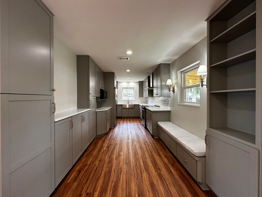 VA Assumable at 2.375%! The home welcomes you into a spacious living area featuring durable, rustic-style luxury vinyl plank flooring throughout. An open-concept layout flows seamlessly into the dining area and chef-inspired kitchen, showcasing quartz countertops, classic shaker cabinetry, stainless steel appliances, a farmhouse sink, and a custom built-in reading bench that adds both charm and function. Just off the kitchen, a versatile mudroom provides space for stackable laundry and a dedicated coffee or beverage station. A central hallway leads to generously sized guest bedrooms, a fully renovated hall bath, and an oversized primary suite complete with a completely upgraded en-suite bathroom. The finished two-car garage offers ample storage with built-in cabinetry. while upgraded French doors with in-glass shutters enhance both style and privacy. Situated on a large corner lot, the property boasts expansive front and back yard space, a jumbo storage shed for lawn equipment, and a Rain Bird irrigation system with controller for easy maintenance. Ideally located near Eglin Air Force Base and Hurlburt Field, this meticulously updated home offers both convenience and quality, with over $60,000 in thoughtful upgrades. Highlights include a stunning kitchen renovation, a brand-new architectural shingle roof (2023), a custom-built rear patio, and beautifully updated bathrooms.
This move-in-ready home combines modern upgrades, functional design, and an unbeatable locationmaking it an exceptional opportunity for buyers seeking quality and convenience.