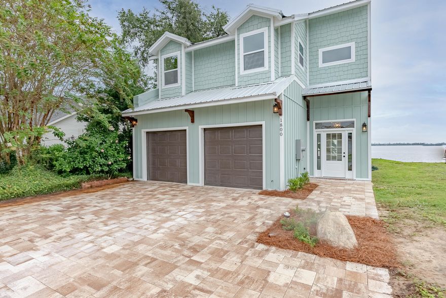 Absolutely beautiful waterfront home with a boat dock and gulf access. The 'Doll House' has been gutted to the studs and is totally renovated. It is like new and absolutely gorgeous. You will love the expansive modern kitchen with an abundance of counter space and cabinets. The living room and a downstairs master suite has a view of the bay. There is a huge deck off of the living room overlooking the water to enjoy grilling and the outdoors with the family. The upstairs master suite is massive with a closet as big as a bedroom and a spacious bathroom with separate tub/shower. It has a wonderful view of the bay. This home has a ton of storage and is very nicely finished. You will be proud to call this one home.