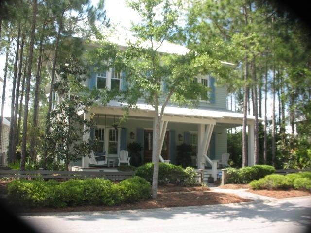 Plenty of privacy, great porches and lots of room best describe this lovely WaterColor home. Bordered by a Nature Preserve, you will enjoy the serenity of the front, side and back porches. The first floor (with 12' ceilings and V-Groove walls) offers an open living, dining and kitchen area, perfect for large gatherings. The first floor master suite with a 12'x17' Master Bath includes a large Travertine shower, tub and double sinks. A Laundry Room/Office and Half Bath also all located on the first floor as well as a 14 x 20 Screened Porch, a 10x36 Front Porch and 9x20 Side/Back Porch. The second floor, with 4 bedrooms...2 with full baths and 2 share a Jack and Jill Bath will accommodate 10. Other features include hardwood floors throughout, plantation shutters, built-ins in closets, atti