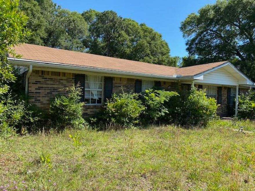 Yard clean up and a little TLC is what this home needs! Three bedrooms, two bathrooms, eat in kitchen, great room and family room in this brick home. Located on a corner lot in central Crestview. Sold AS-IS