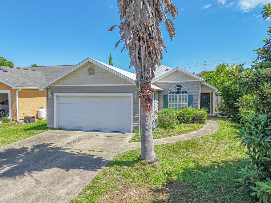 Coastal Charm & Prime Location - Just 5 Blocks from the Beach!  Welcome to this Riviera Beach home, a cheerful 3 bedroom 2 bath home offering 1,344 square feet, built in 2003 and nestled in this PCB west-end  neighborhood.  This beach-side gem is just a short stroll to the Gulf, and offers a bright, open layout with vaulted ceilings, natural light, and tile & carport throughout. The kitchen features stainless steel appliances, plenty of cabinet space and a passthrough bar into the living area - perfect for casual gatherings or entertaining.  The home includes a split-bedroom floor plan, spacious screened-in patio, two full bathrooms and a laundry room.  Located just minutes from Pier Park, Frank Brown Park, 30A, and convenient to local schools, shopping, and PCB events, this home is ideal  as a primary residence, second home or vacation rental.  With NO HOA and strong short-term rental potential, this property delivers excellent value and flexibility.  Schedule your private showing today- beach living is calling!  If measurements deemed important, please verify.