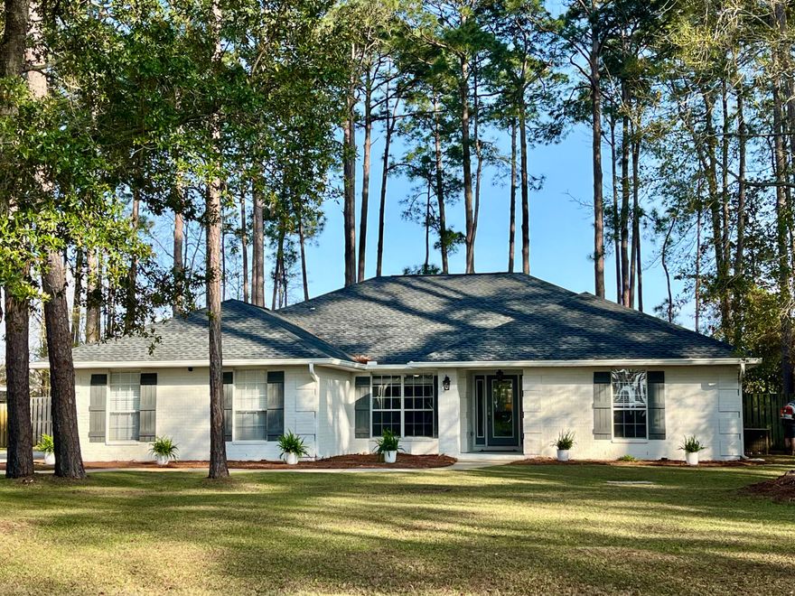 Water-view home on over 1/2 acre lot, in highly sought after Driftwood Estates. Located across the street from the bay. New roof in November 2024. New lawn pump this year. Grand Boulevard and Sandestin just 3 miles away. Located in an ideal, quiet area, this home has 4 bedrooms, 3 baths, with a wet room in the primary bath which includes an oversized, deep soaker tub.  Jack and Jill bathroom between two of the bedrooms. Large flex space can be used for dining room, play room, office or easily converted to a fifth bedroom.  Open concept living/kitchen area with  vaulted ceiling. Quartz counters and gas cooktop in kitchen. Large screened patio.Come check out this sought after location, with plenty of space to add a pool or backyard oasis. Backyard is fully fenced