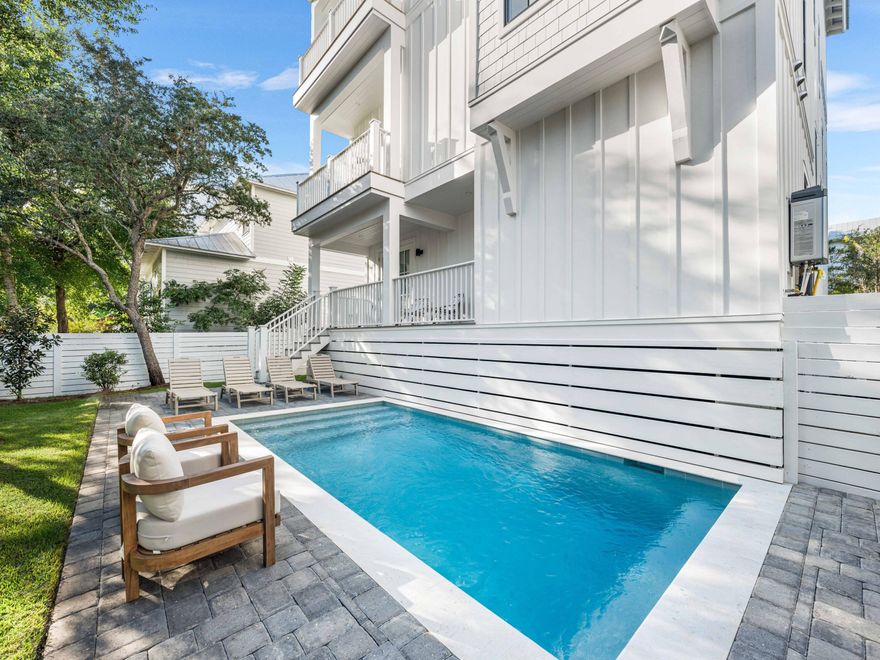 This striking new construction retreat delivers the ultimate in furnished coastal luxury and thoughtful design with panoramic Gulf views and a private pool. Located in the coveted Grande Pointe community of Inlet Beach and spanning 3,572 square feet across four thoughtfully designed levels, this home features 6 spacious bedrooms, 4 full baths, and 2 half baths--masterfully blending indoor comfort with outdoor indulgence for effortless beachside living and refined entertaining. Designed with function and style in mind, this residence includes two expansive living areas--ideal for multi-generational living or hosting guests with ease. Exceptional features are an elevator that services all 4 levels plus a top rooftop that is reinforced and plumbed for a hot tub. The second-level, open-concept main living area features abundant natural light, coastal-inspired finishes, and seamless flow to the dining and kitchen areas, while the third-level lounge provides a second gathering space with convenient access to wet bar amenities.

On the third floor, the primary suite offers a serene retreat with an ensuite bath with dual vanities, while a second primary suite on level two has an ensuite with jack-and-jill access to another guest bedroom. Additional bedrooms are thoughtfully arranged throughout the home, and there's a dedicated home office that could be utilized as a bedroom on the ground floor for remote work or study.

Enjoy exceptional. Gulf views and year-round breezes from the spacious tower-level with covered and open-air deckspace, complete with a summer kitchen which is perfect for al fresco dining. The private pool and sundeck, also featuring a pool bath, offers your own backyard oasis, ideal for relaxing after a day at the beach or entertaining under the stars. Additional highlights include a breakfast bar on the third floor, 2 dishwashers in the kitchen, covered porches and open balconies totaling over 1,100 sq ft of outdoor space, two-car garage plus additional driveway parking, and a smartly placed laundry room with a double washer and a double dryer for added convenience.

As a resident of Grande Pointe, you'll enjoy private access to Lake Powell, one of the area's rare coastal dune lakes, along with an amenity-rich community that includes a swimming pool, clubhouse, and dock for paddleboarding or kayaking. The neighborhood is ideally located near several public beach accesses, the natural beauty of Camp Helen State Park, and the boutiques and dining of 30Avenue. With easy access to Highway 98, the new pedestrian underpass to 30A, and nearby airports in Panama City Beach and Destin, this home is well suited for use as a primary residence, vacation retreat, or rental investment.