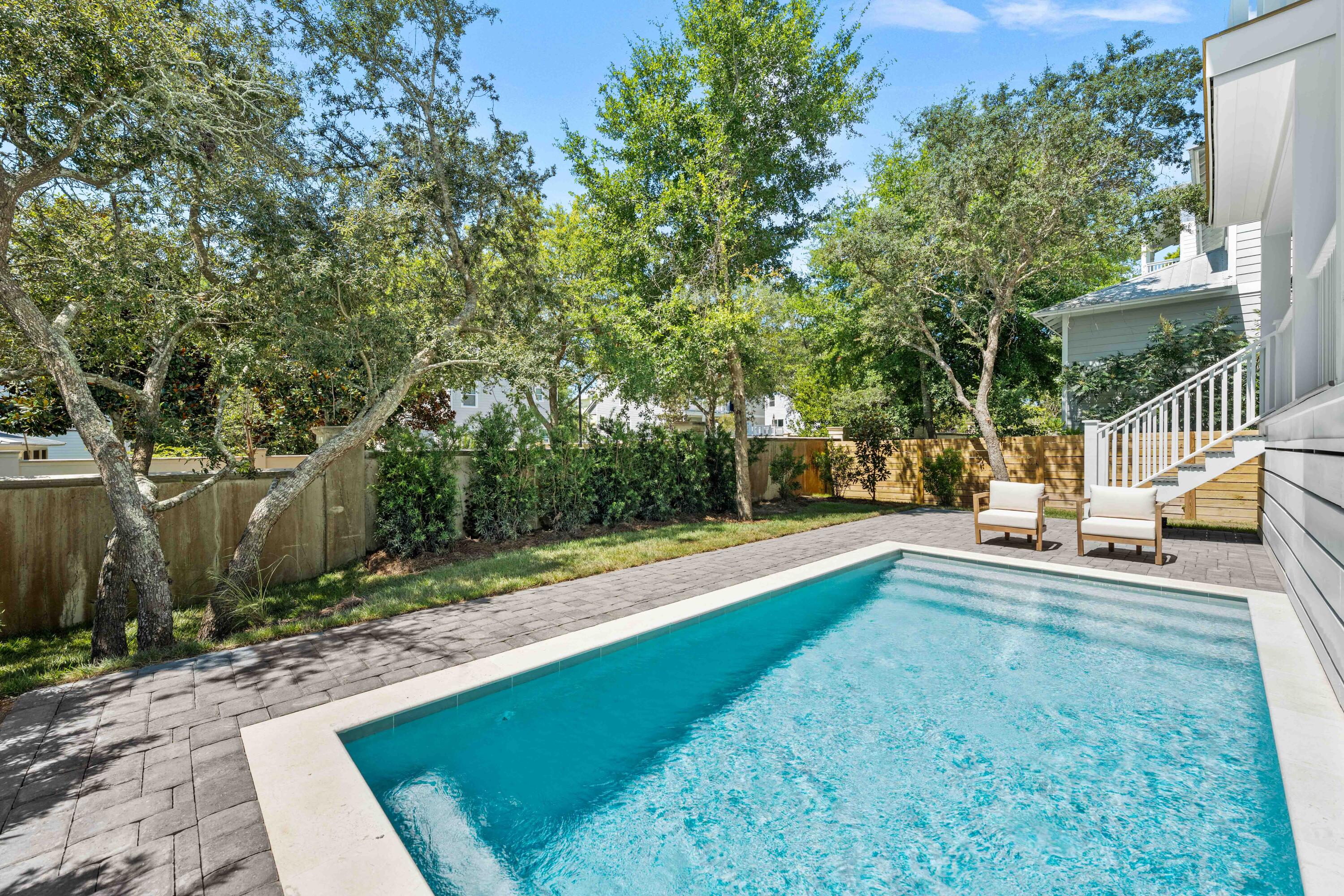 This striking new construction retreat delivers the ultimate in furnished coastal luxury and thoughtful design with panoramic Gulf views and a private pool. Located in the coveted Grande Pointe community of Inlet Beach and spanning 3,572 square feet across four thoughtfully designed levels, this home features 6 spacious bedrooms, 4 full baths, and 2 half baths--masterfully blending indoor comfort with outdoor indulgence for effortless beachside living and refined entertaining. Designed with function and style in mind, this residence includes two expansive living areas--ideal for multi-generational living or hosting guests with ease. Exceptional features are an elevator that services all 4 levels plus a top rooftop that is reinforced and plumbed for a hot tub. The second-level, open-concept main living area features abundant natural light, coastal-inspired finishes, and seamless flow to the dining and kitchen areas, while the third-level lounge provides a second gathering space with convenient access to wet bar amenities.
On the third floor, the primary suite offers a serene retreat with an ensuite bath with dual vanities, while a second primary suite on level two has an ensuite with jack-and-jill access to another guest bedroom. Additional bedrooms are thoughtfully arranged throughout the home, and there's a dedicated home office that could be utilized as a bedroom on the ground floor for remote work or study.
Enjoy exceptional. Gulf views and year-round breezes from the spacious tower-level with covered and open-air deckspace, complete with a summer kitchen which is perfect for al fresco dining. The private pool and sundeck, also featuring a pool bath, offers your own backyard oasis, ideal for relaxing after a day at the beach or entertaining under the stars. Additional highlights include a breakfast bar on the third floor, 2 dishwashers in the kitchen, covered porches and open balconies totaling over 1,100 sq ft of outdoor space, two-car garage plus additional driveway parking, and a smartly placed laundry room with a double washer and a double dryer for added convenience.
As a resident of Grande Pointe, you'll enjoy private access to Lake Powell, one of the area's rare coastal dune lakes, along with an amenity-rich community that includes a swimming pool, clubhouse, and dock for paddleboarding or kayaking. The neighborhood is ideally located near several public beach accesses, the natural beauty of Camp Helen State Park, and the boutiques and dining of 30Avenue. With easy access to Highway 98, the new pedestrian underpass to 30A, and nearby airports in Panama City Beach and Destin, this home is well suited for use as a primary residence, vacation retreat, or rental investment.