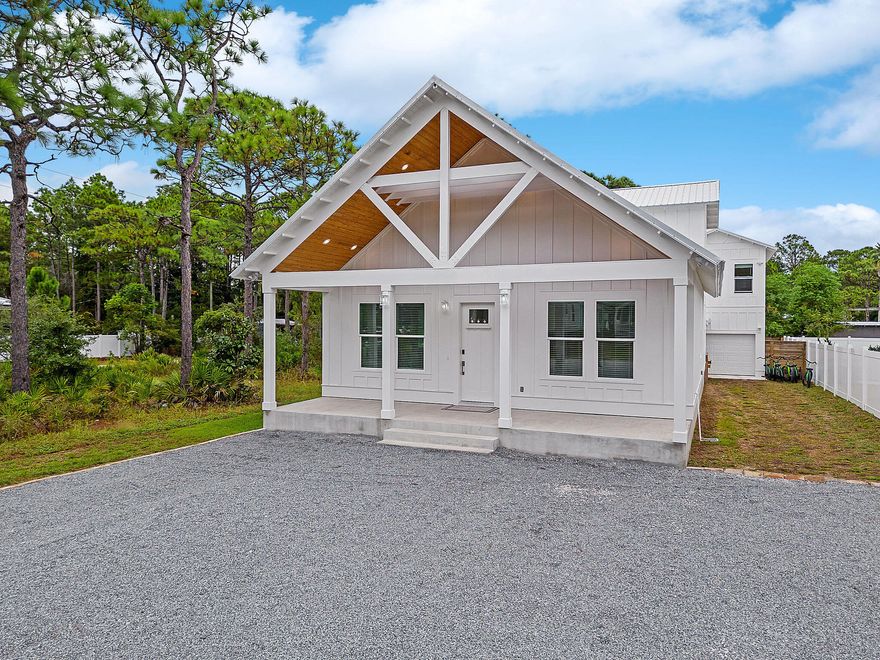 Built in 2022, this modern Gulf Shore Manor home is a beacon of contemporary luxury. With modern decor and furnishings, it offers a fresh take on coastal living. Nestled in a non-HOA community, this property presents a golden investment opportunity. Situated just half a mile from the Gulf and the San Juan Beach access, it is a prime spot for short-term rentals. Enjoy the ultimate relaxation with your own private pool and hot tub, complemented by outdoor entertaining space. Natural light floods every room, creating an inviting ambiance. The home has 5 bedrooms and 4.5 bathrooms catering to both accessibility and comfort. There is an additional bonus room upstairs with flexible space for a game room, media room or additional bedroom conversion. A carriage house with a kitchenette adds