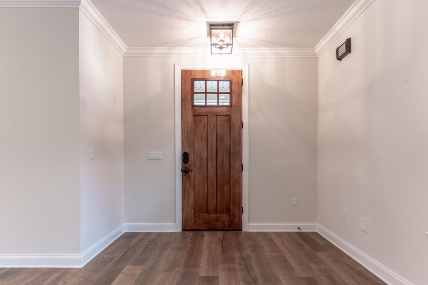 $12,000 ANYWAY MONEY! Down payment assistance, interest rate buy down, closing costs, and/or washer & dryer! USE IT ANYWAY YOU WANT! Prepare to be amazed by the well-appointed kitchen that is both functional and aesthetically pleasing. Featuring beautiful granite countertops, a charming farm-style sink, and a convenient breakfast bar, it's the perfect spot to whip up gourmet meals or host casual gatherings. The walk-in pantry provides ample storage space, ensuring a clutter-free and organized cooking experience. Escape to your private sanctuary in the downstairs master suite. Pamper yourself in the en-suite bathroom, complete with dual vanities, a separate shower, and a freestanding tub, promising a spa-like experience. French doors open to the covered lanai, inviting you to bask in the Kitchen Cabinets: White, Counter tops:  Calacatta Laza Quartz
Master Bath cabinets: Espresso, Counter tops: Bianco Antico Granite, 2 white spa sinks
Bath 2 : Cabinets Espresso, Counter tops: White on White Marble
Exterior Stone: Atlanta Brown
Wood: Pergo, Wheaton Oak -Foyer, Kitchen, Dining, Family, Flex/Study, Hallways, All Bedrooms and Closets
Tile: 12X24 Vining Blanco- Baths and Utility
Hardware:  Oil-Rubbed Bronze
Front Door: Gel-Stain- Hickory
Interior Walls: Aesthetic White
Blinds: 2" Faux wood white