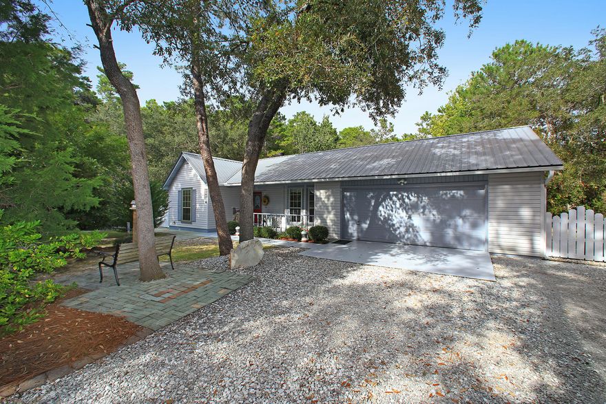 HIDDEN GEM in Santa Rosa Beach. This original 3BR/2Ba home has a large sunroom and 2 and half garage. Breathtaking landscaping and outdoor living areas with fire pit and a tree house. This home is a must see as it sits on two lots. The lot is approximately 1.2 acres with mature trees including live oaks. Great location close to shopping, hospital, restaurants, and other services. Beautiful home in a great desirable location. Adjoining lot available (MLS #784063). Buyer to verify all data, details and specifications important to them.