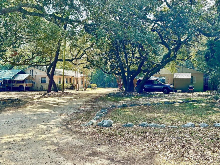 .4 ACRE PROPERTY WITH 2 DUPLEX RENTAL PRODUCING UNITS.  Each unit (4 total units)  includes 2 bedrooms and 1 bath each with 625 SF.  Total of 8 bedrooms and 4 baths for 2500 SF with rental income of $3000 monthly.  This listing is Lot 11 BKL 2 of Parcel ID # 28-1S-21-41020-002-0110.  Buyer to confirm all dimensions, utilities, and zoning.  See MLS numbers 917342 and 917067 for separate prices.  SELLER FINANCING AVAILABLE