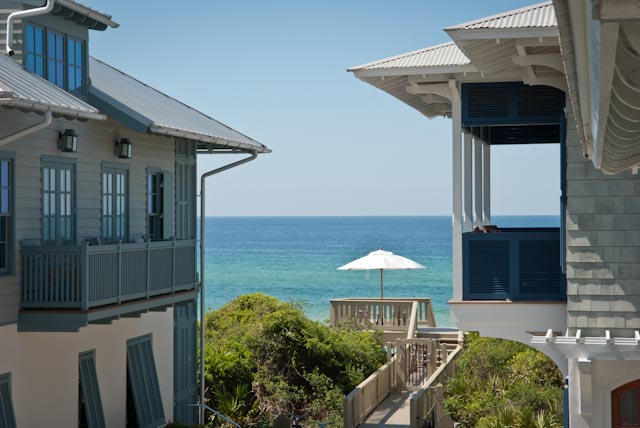 Amazing views from this second tier home. Just a few steps down the boardwalk to the beach, no streets to cross. Designed by renowned architecht George Israel to be a playful, yet sophisticated beach home. Plenty of great details throughout. The main house features a reverse floor plan to take advantage of the gulf views. On the first floor, there are 3 bedrooms, each with their own bath, and a quiet reading porch. The main living area is located on the second floor with a gas fireplace, built in office nook and two large open air porches. The third floor showcases a bonus sleeping loft/playroom and a lookout balcony with views of the gulf and the rooftops of Rosemary Beach. A well designed carriage house can accommodate additional guests. The best priced 2nd row home in Rosemary!