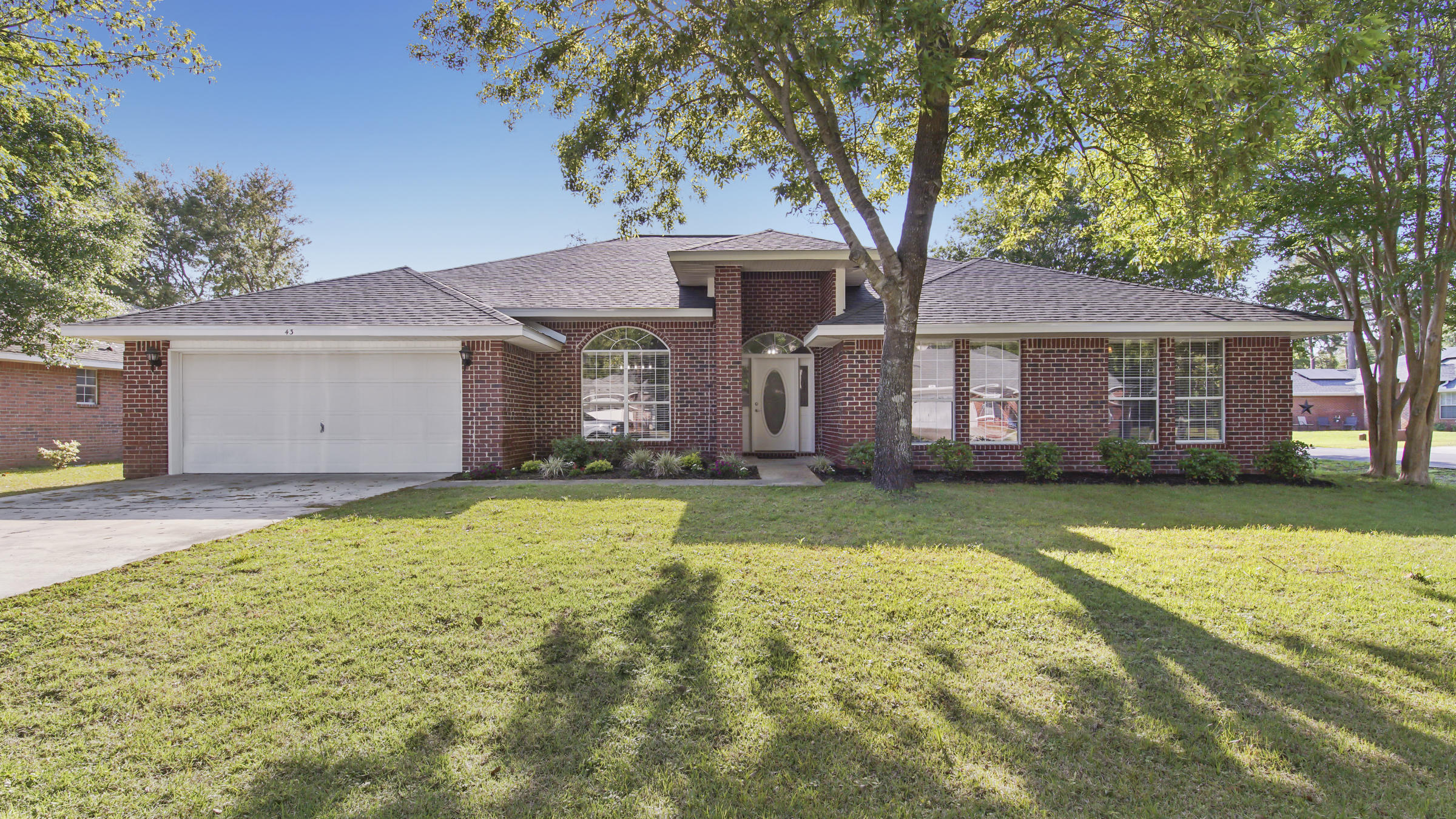 NO PETS! This home features, giant open living rm, dining room, eat in kitchen, extra large kitchen plus a very large panty. Quartz countertops, all new appliances, 2 kitchen islands. Freshly painted, new vinyl wood plank flooring. All baths have new countertops, lighting, Master Bath has newly tiled shower with glass doors. Washer and dryer included. 4 good size bedrooms and 3 full baths. New roof just installed, there is a 10 X 14 screened porch on the back plus a glassed in 10 X 40 sunroom with a separate ac unit. Mature trees sitting on a corner lot. 2 car garage, fenced in back yard. Quiet subdivision low HOA's and a community pool.