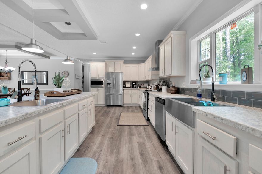 This beautiful manufactured home provides the peaceful serenity that you are looking for.  This property is sitting on 8.83 acres of lush and tranquil land that has a running creek, wooded areas, and plenty of space to let your imagination run wild.  The home itself is new (1 year) and features fresh carpet in all 3 bedrooms and wonderful open flow between the living area, utility room, and the one-of-a-kind chef's kitchen that has a huge island with a breakfast bar.  Each bedroom is spacious, and the primary bedroom has an en-suite bathroom with a zero-entry walk-in shower, a free-standing soaking tub, and a walk-in closet with custom shelving.  Feel free to reward yourself by visiting this beautiful home.