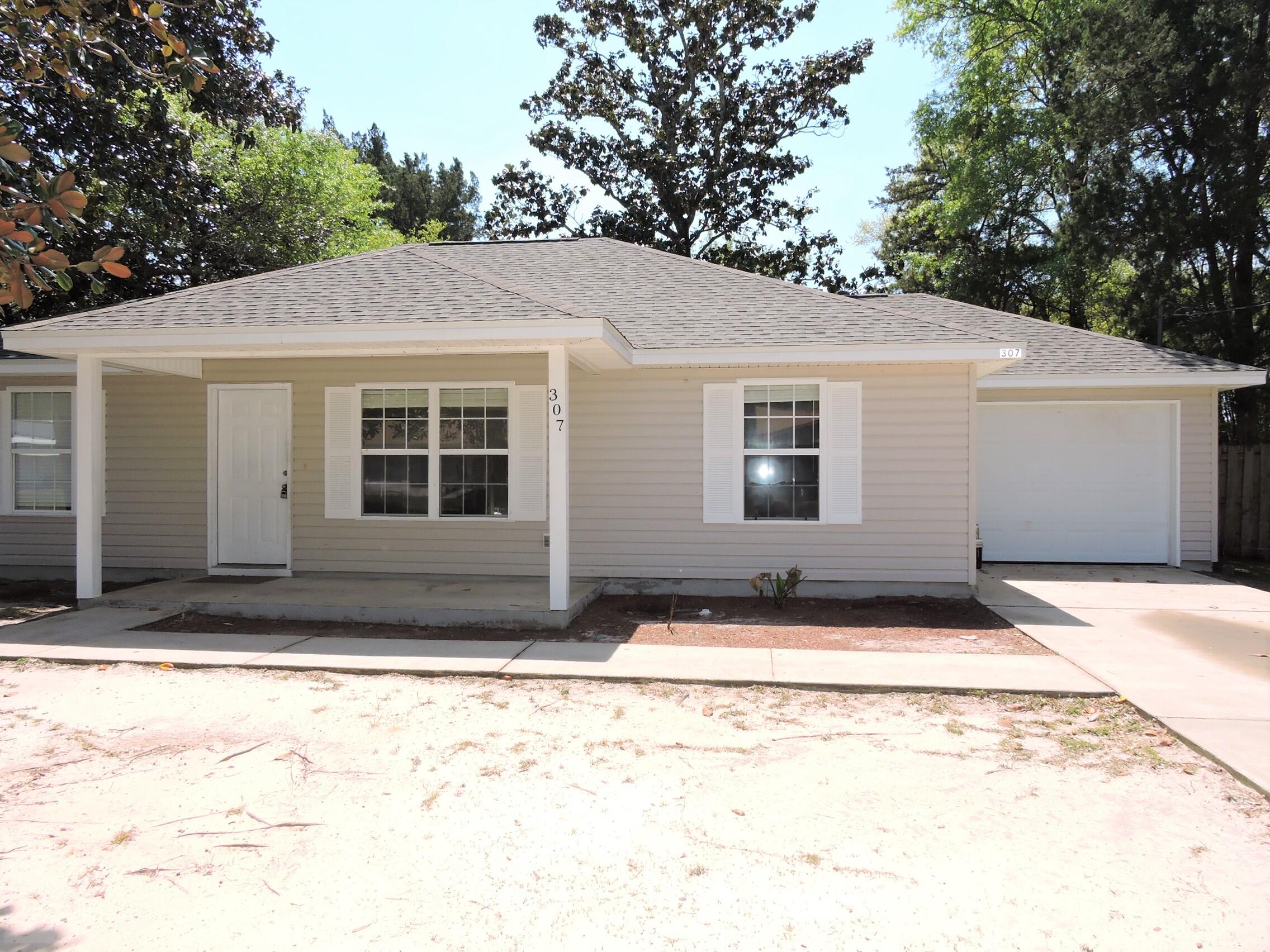 Fantastic home just outside of the EAST gate of EGLIN AFB! Brand new roof, new water heater, new HVAC system, new bathroom vanities, new bathroom toilets, and new bathroom light/mirrors. Totally painted inside including walls, trim and garage. NO CARPET - tile and LVP. Fully fenced back yard.