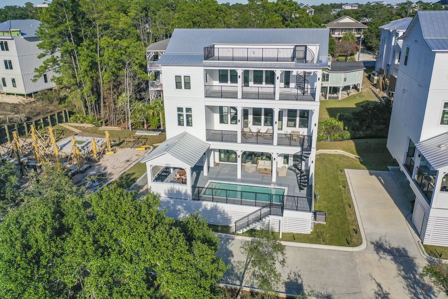 Imagine watching the sunset over 30A from the rooftop lookout, and then enjoying a swim in your private pool before either grilling on the pool deck or cooking in your chef's kitchen. The Preakness at the Beach has so much to offer! With 5 bedrooms PLUS an additional bunk room and two separate living areas, this home can comfortably sleep at least 16 guests for your vacation. On the pool level you will find a living room, two full bedrooms with ensuite bathrooms and a half bath for guests. On the second floor you will find a Chef's Kitchen with a Viking Range and oversized Fridge, wine cellar, pellet ice maker, two sinks, oversized island and bar seating for entertaining, pot filler for convenience while cooking, and more. On the main level there are also two sets of (see more) washer and dryer units as well as a half bath just off the kitchen. On the top floor there are 3 bedrooms with their own private bathrooms, as well as a bunk room with 2 sets of twin bunk beds, adjacent to a reading nook overlooking the balcony. From the balcony you can take the spiral stairs up to the private observation deck to relax, sun bathe, enjoy the Gulf views and sea breeze and more! Being sold fully furnished, this home is ready for you to enjoy today, with an elevator for easy accessibility and for moving luggage upstairs. This custom home was built on a concrete pile cap foundation to ensure peace of mind for years to come. Make an appointment to see this home today in person!