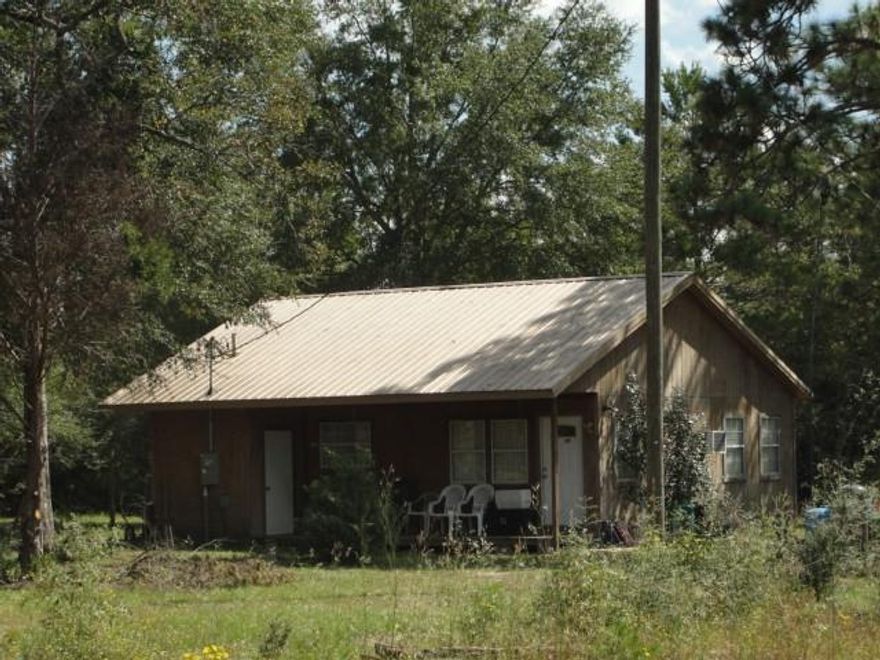 TWO FOR THE PRICE OF ONE! 6.5 Acres of level, high and dry land with two homes and workshop. House 1 has 1076 SF under roof, 2BR, 1BA, vinyl siding, metal roof, built 1987. House #2 is 1Br, 1BA, has unfinished bonus area in attic, 984 SF under roof, built in 1990.Both properties are currently rented and generate $975 per month in rental income. Sale will be subject to the rentals in place, but possibility that tenant in 2 BR house would vacate early. There is also a 20x32 metal workshop building that was built in 1998,needs some TLC, but is very usable. Has concrete slab and separate power meter. SF and Year of construction based on property appraiser records. Property is somewhat private.