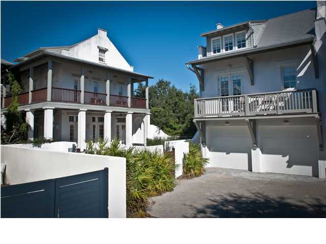 THIS SPACIOUS LOT HOST A MAIN HOUSE AND CARRIAGE HOUSE WITH AN ENORMOUS COURTYARD BORDERED BY A WRAP-A-ROUND VERANDA AND BALCONY. An impressive Arched Mahogany Door allows a New Orleans style entry from the Boardwalk into the side porch of the Main House. No less than 6 sets of French doors flow out to the Courtyard from the Level 1 open Living/Dining/Kitchen with an alcoved sitting room and Full Bath. Level 2 has the Master Suite with Bath as well as a Bunk room and 2 Guest Bedrooms and Guest Bath. Level 3 enjoys an Party Room with side bar that may be converted into an extra Guest room with 2 trundle built in beds and a full Bath. The Carriage House has a separate entrance outside the Courtyard. Level 1 over the garage has the Living/Ding/Kitchen with a half bath and bunk room.