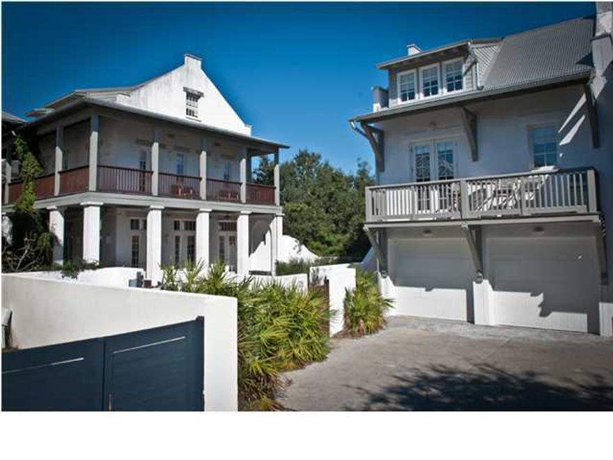 THIS SPACIOUS LOT HOST A MAIN HOUSE AND CARRIAGE HOUSE WITH AN ENORMOUS COURTYARD BORDERED BY A WRAP-A-ROUND VERANDA AND BALCONY. An impressive Arched Mahogany Door allows a New Orleans style entry from the Boardwalk into the side porch of the Main House. No less than 6 sets of French doors flow out to the Courtyard from the Level 1 open Living/Dining/Kitchen with an alcoved sitting room and Full Bath. Level 2 has the Master Suite with Bath as well as a Bunk room and 2 Guest Bedrooms and Guest Bath. Level 3 enjoys an Party Room with side bar that may be converted into an extra Guest room with 2 trundle built in beds and a full Bath. The Carriage House has a separate entrance outside the Courtyard. Level 1 over the garage has the Living/Ding/Kitchen with a half bath and bunk room.