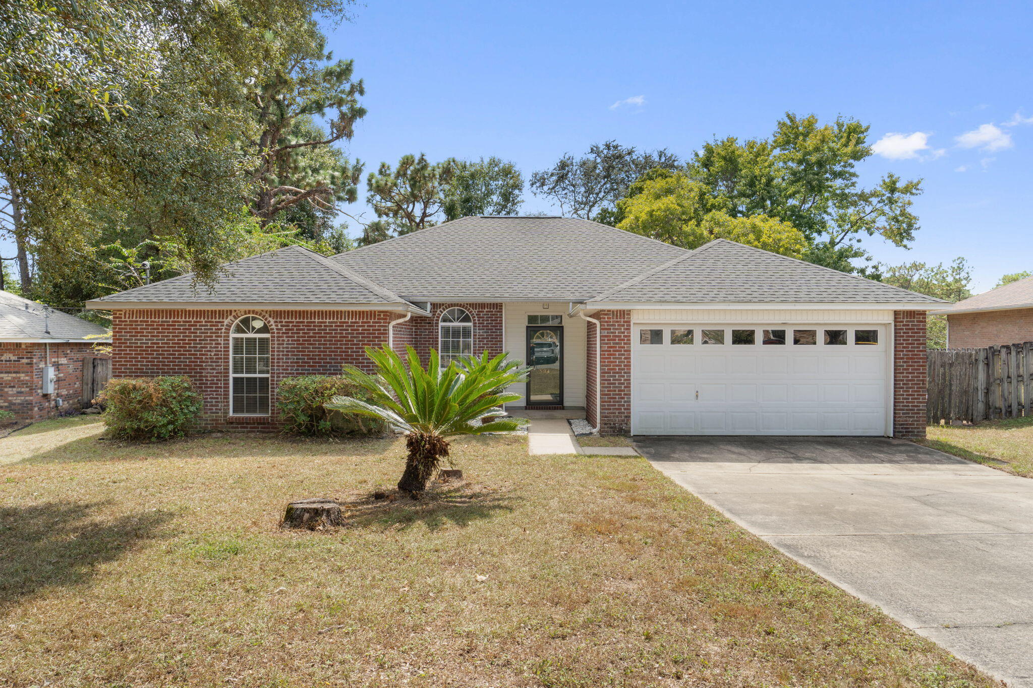 Welcome to 394 Riverchase Blvd!This 3-bedroom, 2-bath home offers a 2022 roof and a layout designed for easy everyday living. The split-bedroom floor plan features a vaulted ceiling in the living room and a fireplace for added charm.In the kitchen, you'll find granite countertops, freshly painted cabinetry, and a full set of appliances. The home also has fresh paint throughout, updated bathroom vanities and mirrors, and durable LVP and tile flooring. The primary suite stands out with a large walk-in closet and a spacious bath featuring dual vanities.Step outside to enjoy the screened-in back porch, fenced backyard, and storage shed. Blinds are already installed, and the washer, dryer, and an additional refrigerator in the garage are included for extra convenience.Move-in ready and well cared for, this home is ready for its next chapter.
