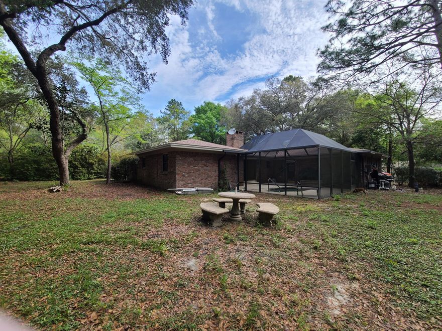 Home is located in the Great Community area of  Rocky Bayou Estates off of Edgewater Dr. Large lots like this with a Brick home are hard to find in Niceville.  Home offers 3 Bedroom 2 Bath with Fireplace, Pool, Built in Spa, 2 Car Garage and Workshop. Home has updated Roof, A/C, Hot Water Heater, Generator.  No issues with getting insurance on this Great home.