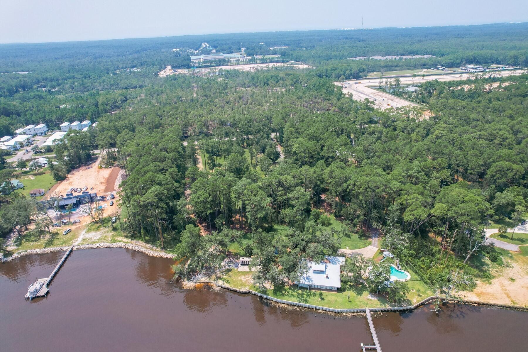 Welcome to your dream coastal retreat! Situated along the shores of the Choctawhatchee Bay, this 3+ acre build-able lot offers over 200 feet of bay frontage and an unrivaled opportunity to create your waterfront haven. Experience piece and tranquility with a view, while still being right in thick of what this area has to offer; minutes drive from the shops, restaurants, and beaches of 30A and just across the bridge from the town of Freeport. The lot is equipped with essential utilities: Electricity (2 temp power poles located in separate locations of the lot), water, and sewer connections, all readily accessible, streamlining your journey to realizing your coastal dream. Survey available, drive by and see it today!