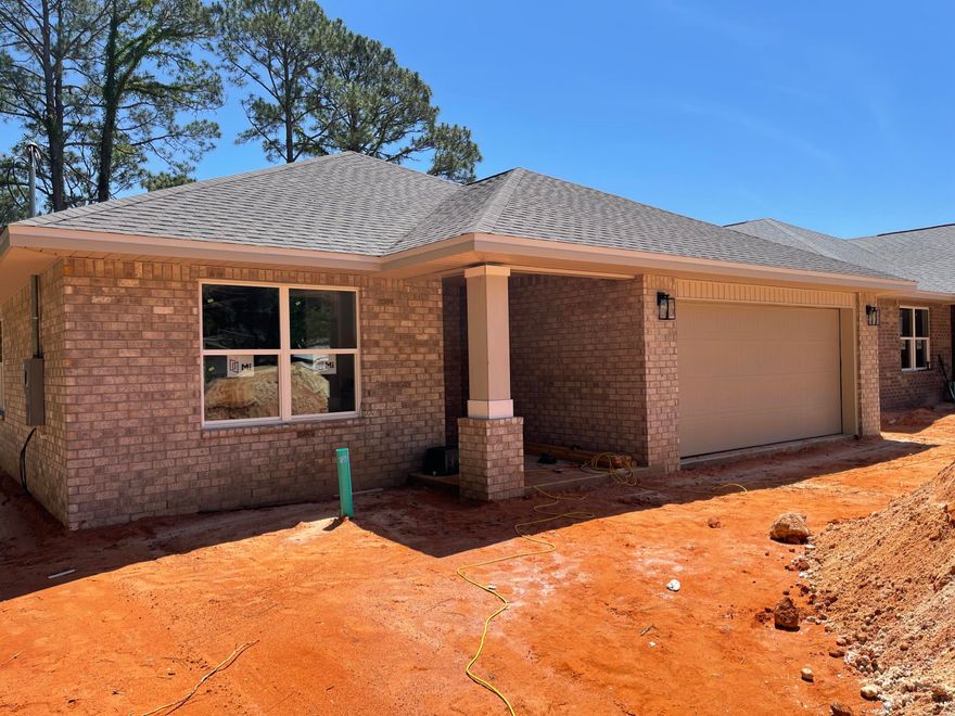 BRAND NEW 2023 ALL BRICK HOME NESTLED ON PEACEFUL END OF STREET LOT SURROUNDED BY OTHER NEW 2023 HOMES! Upon entry thru a deco top glass front door you are welcomed into a expansive living & dining space accented w/crown molding, recessed ceiling & tasteful lighting throughout.  The KITCHEN is located in a cozy front of home corner & is topped off w/huge Sunny window! It boasts QUARTZ counters, large sink, White shaker style cabinets w/soft close drawers w/ ''coffee'' area counter cabinet, Stainless appliances, smooth cook top range, Built in Microwave, Long/Large eat up bar & Corner pantry. MASTER BATH - QUARTZ counters, dual sink, Large shower w/glass door & wide sitting bench. Walk-in closet with shelf nook. MASTER BR: Ceiling fan, puck LED lights, recessed ceiling w/crown. PLUS: Quality low maintenance wood plank Vinyl flooring in living areas. Stylish 12x24 tile in baths. Carpeted bedrooms. 2" Blinds on windows. Roomy covered back porch, Privacy fenced yard (43'+ deep) for a quaint place to relax in private & possible future pool, Large Laundry Room w/white shaker cabinetry and a bonus nook area for future storage/shoe bench/cabinetry, etc... Hall Bath 2 has QUARTZ counters and tub/shower combo. ADDITIONAL FEATURES:
No HOA.  Sprinkler System, Hurricane fabric shield, Quiet End of Street lot, One year builder warranty and more!
Located in close proximity to Hurlburt AFB, Beautiful Navarre Beaches, shopping, eateries and schools.
A NEW Home Ready Estimated End of May 2023 for a First Owner!! 
Wont last long! Call today to see!