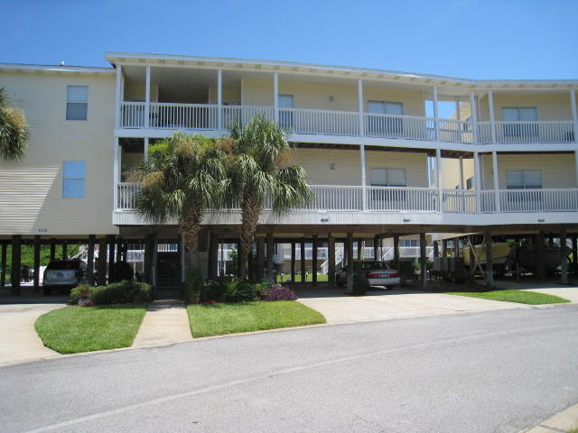 DO NOT MISS THIS ONE!!! This CANAL FRONT desired upstairs unit has many extra features added by the builder that other similar units do not have. Unit has views from the balcony of the harbor and the golf course. This condo is tastefully decorated and is rental ready. The assigned covered parking located under the unit is a great amenity for owners, renters and boaters. Sandpiper Cove amenities include 1100 feet of private beach front with pavilion, 5 pools, 6 tennis courts, marina slips for lease, canal boat docking by reservation, Louisiana Lagniappe fine dining restaurant, and a 9 green par 3 golf course. Buyer to verify footage and room dimensions.